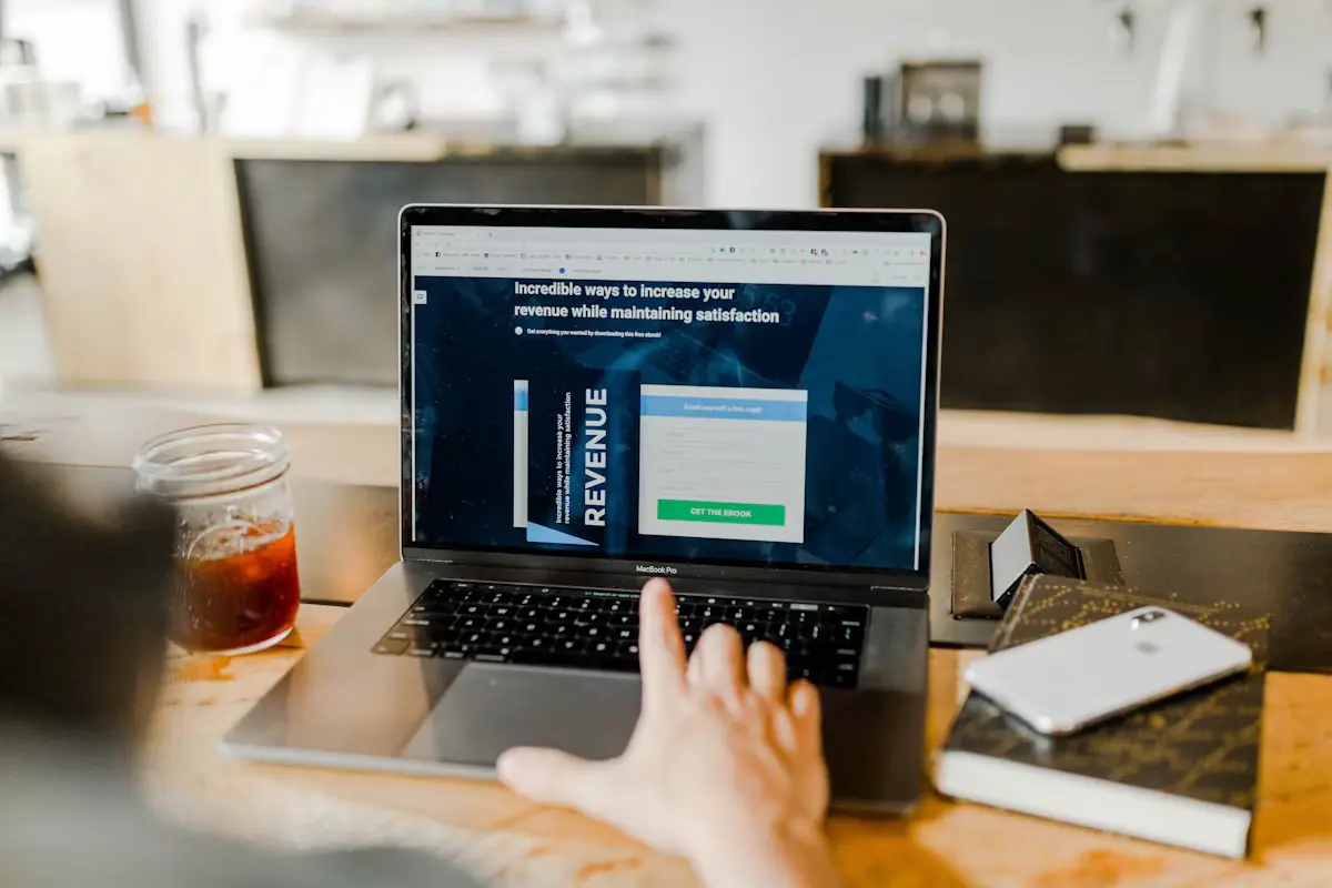 Link building service specialist reviewing social media strategy on laptop and phone